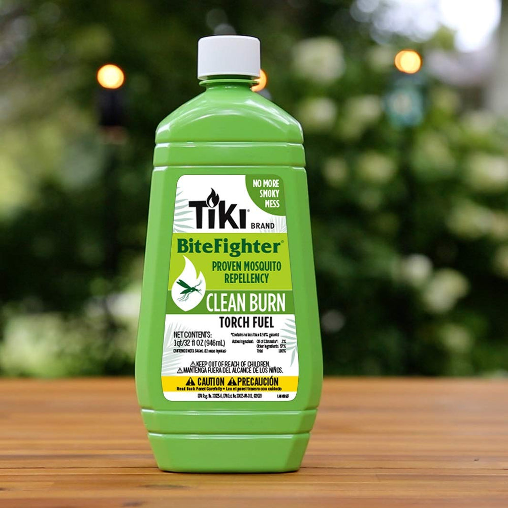 TIKI Clean Burn fuel in a patio torch setup, designed for mosquito repellent use.