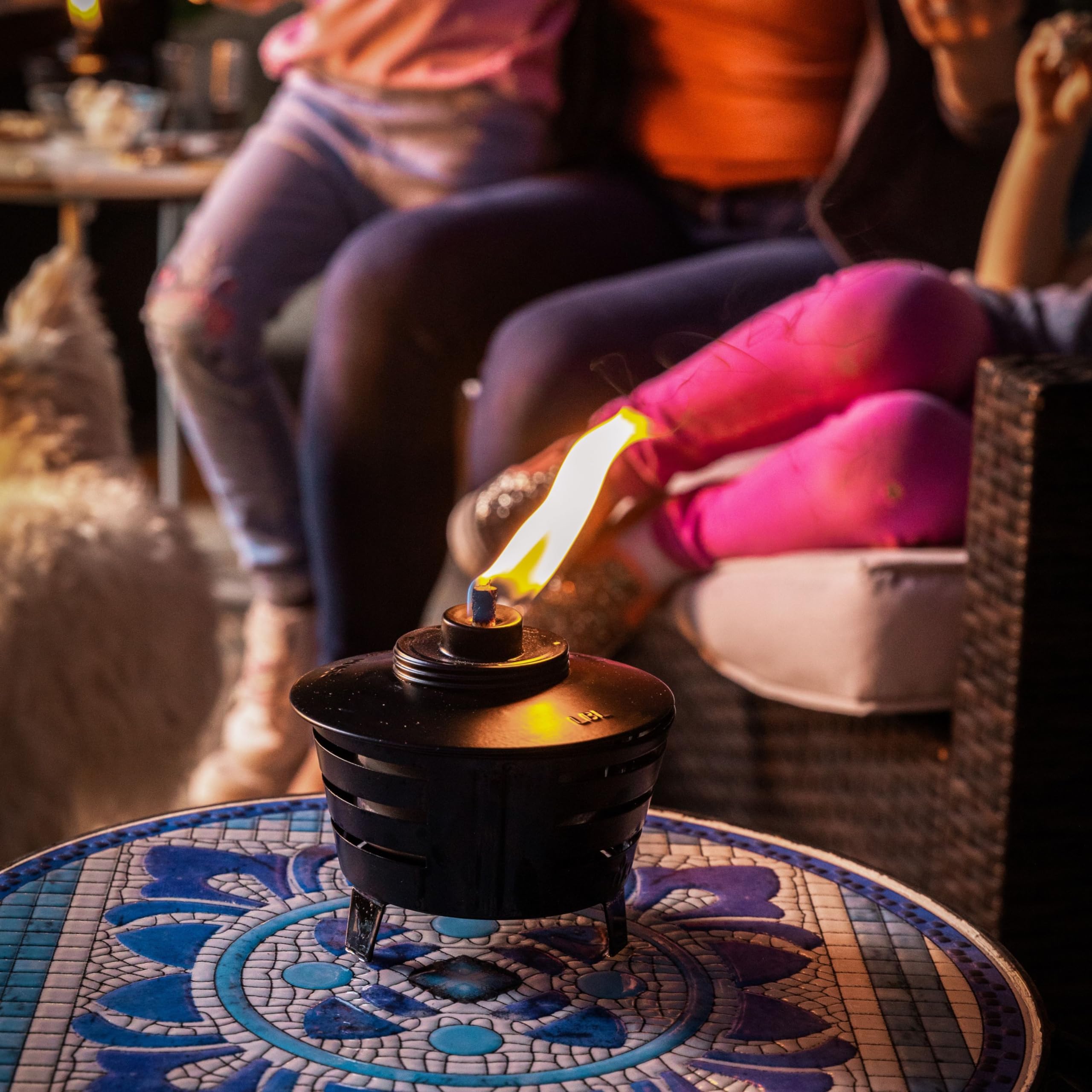TIKI Mini Pit Table Torch features a long-lasting fiberglass wick for a steady flame.