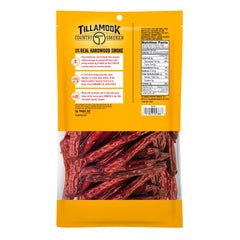 Sliced Tillamook sausages on a board showcasing hardwood smoke flavor