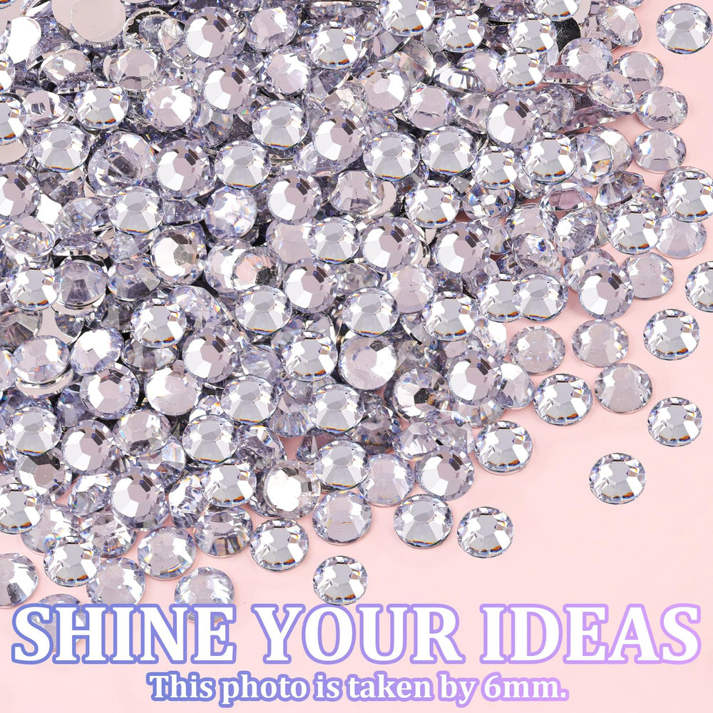 TINKRSTUFF tweezers and pickup pen for precise rhinestone placement.