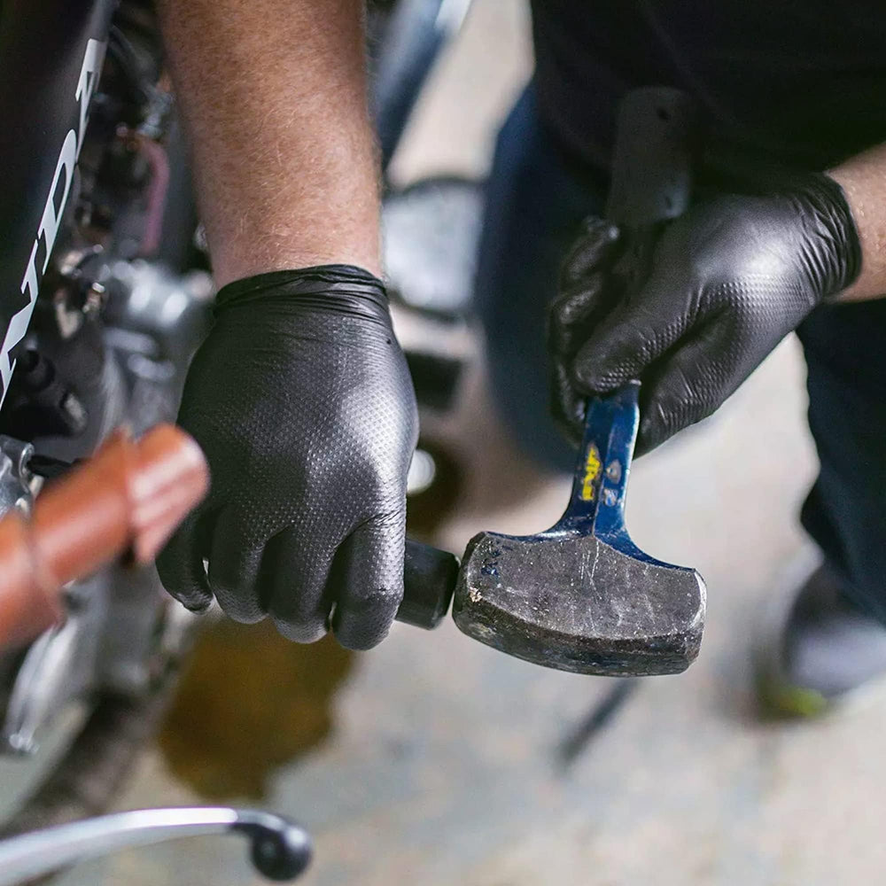 TitanFlex black nitrile gloves resist oil and grease during maintenance tasks