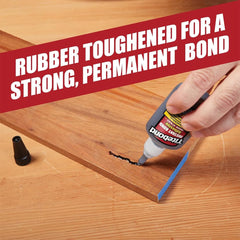 Titebond Instant Bond Jet Black cured finish on wood sample demonstrates glossy black repair.