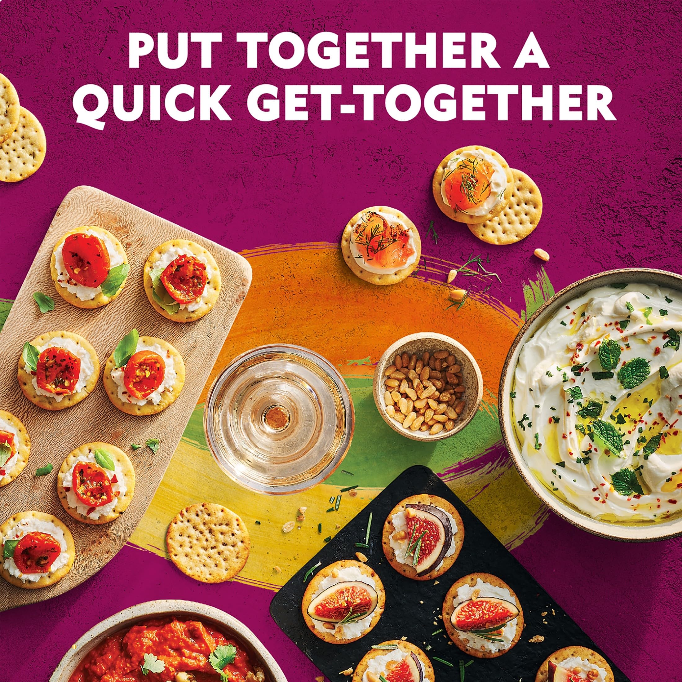 Toasteds crackers served with hummus and veggie spreads for gatherings.