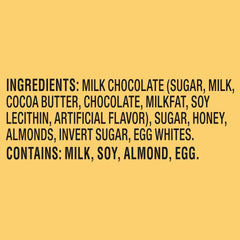 Toblerone honey almond nougat close-up emphasizes texture and indulgence.