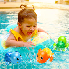 TOHIBEE orange turtle wind-up in tub encourages fine motor play.