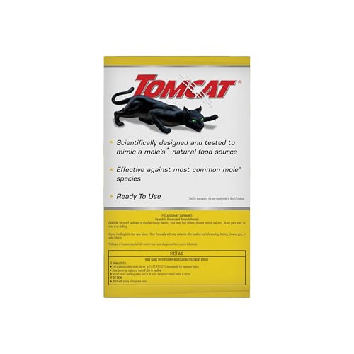 Tomcat Mole Killer lawn shows conical mounds and damage signs near garden.