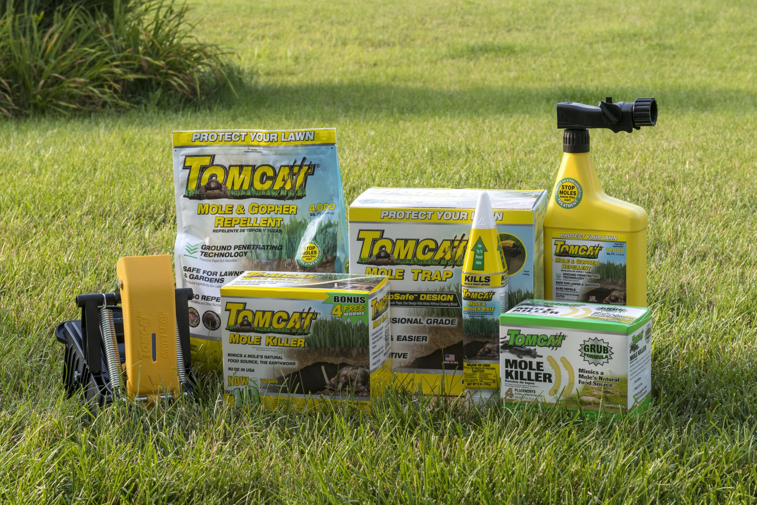 Tomcat Mole Killer ready-to-use bait on lawn for straightforward runway treatment.