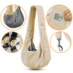 Tomkas sling cream front pocket open for convenient storage of keys and treats.