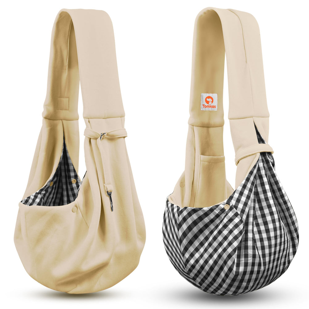 Tomkas shoulder strap worn demonstrates hands-free carrying during walks.