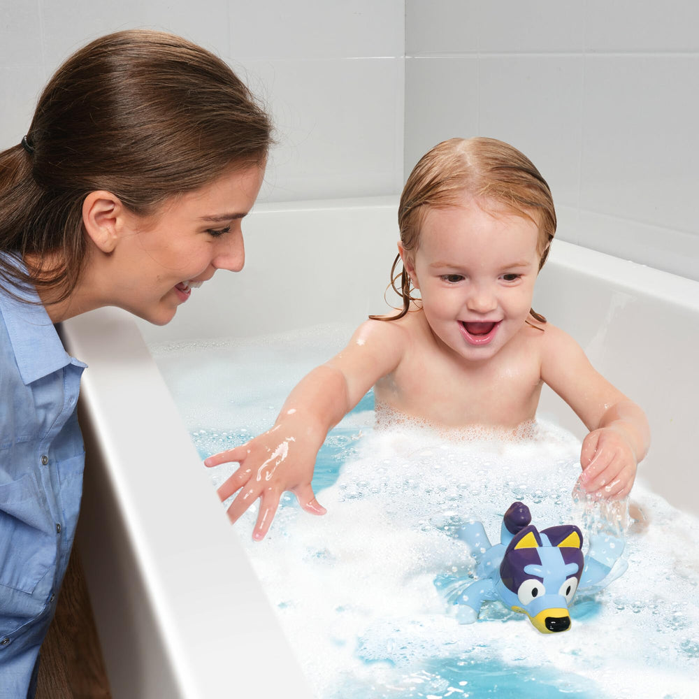 TOMY Toomies Bluey shows backstroke during pretend swim.
