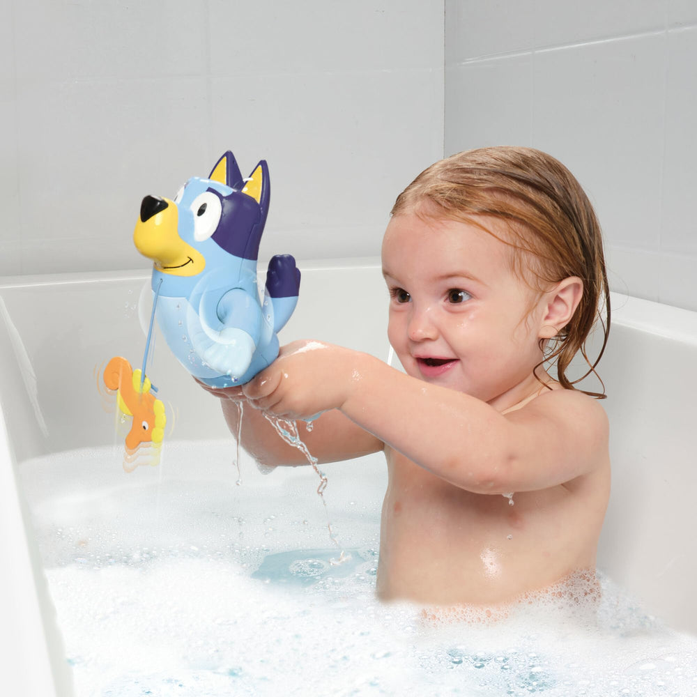 TOMY Toomies Bluey with retractable seahorse cord promotes cause-and-effect play.