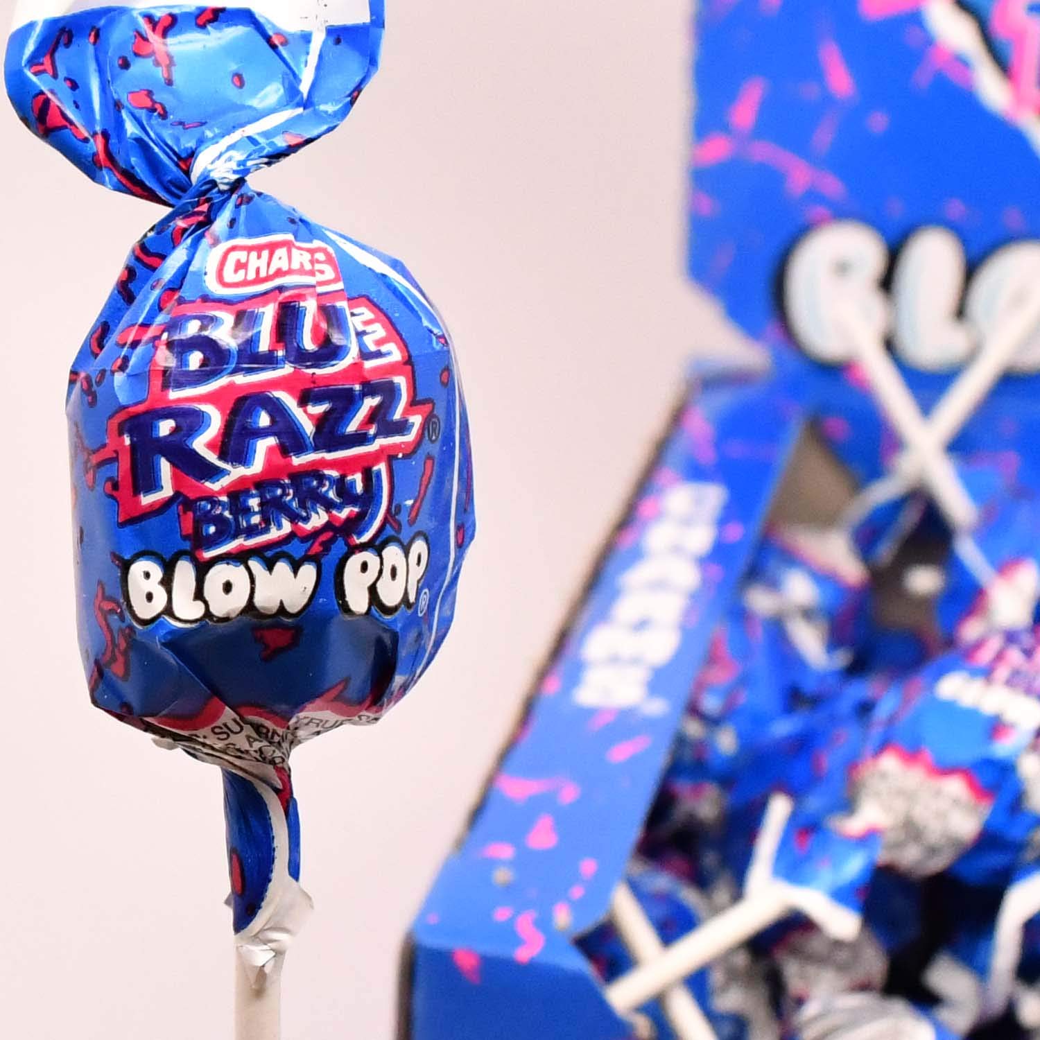 Tootsie Roll Charms Blow Pops, candy shell and gum center closeup.