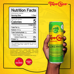 Topo Chico Lime with Mint pours into a glass showing refreshing fizz.