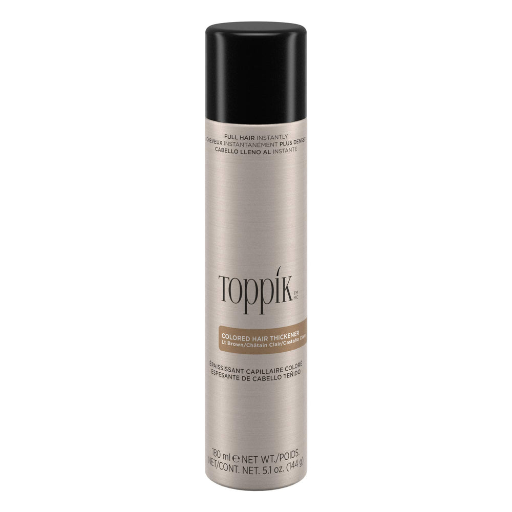 TOPPIK colored hair thickener spray in light brown for fuller roots.