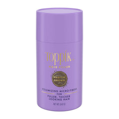 Toppik Hair Filler Medium Brown bottle applied at the hairline for natural fullness
