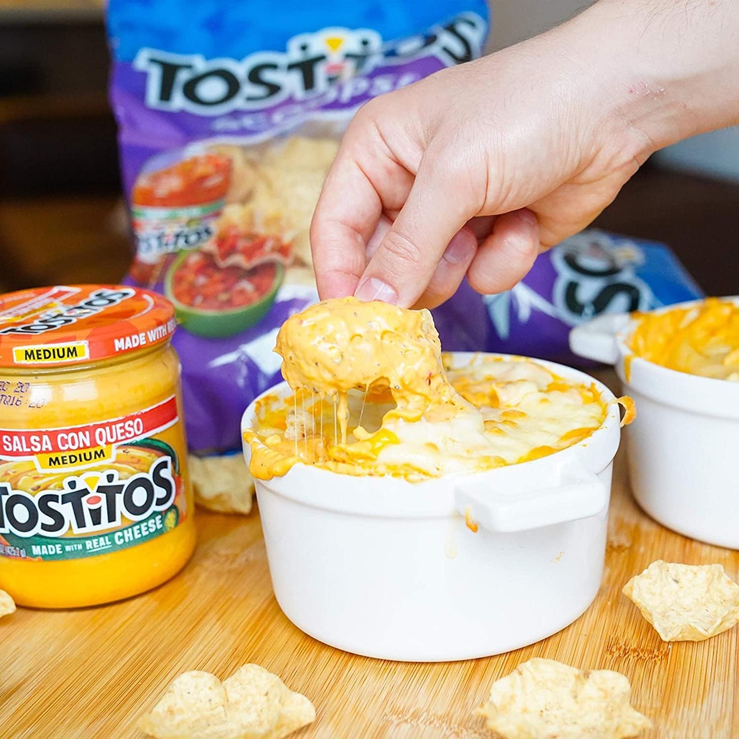 Tostitos Queso Variety Pack party table setup with chips and dips