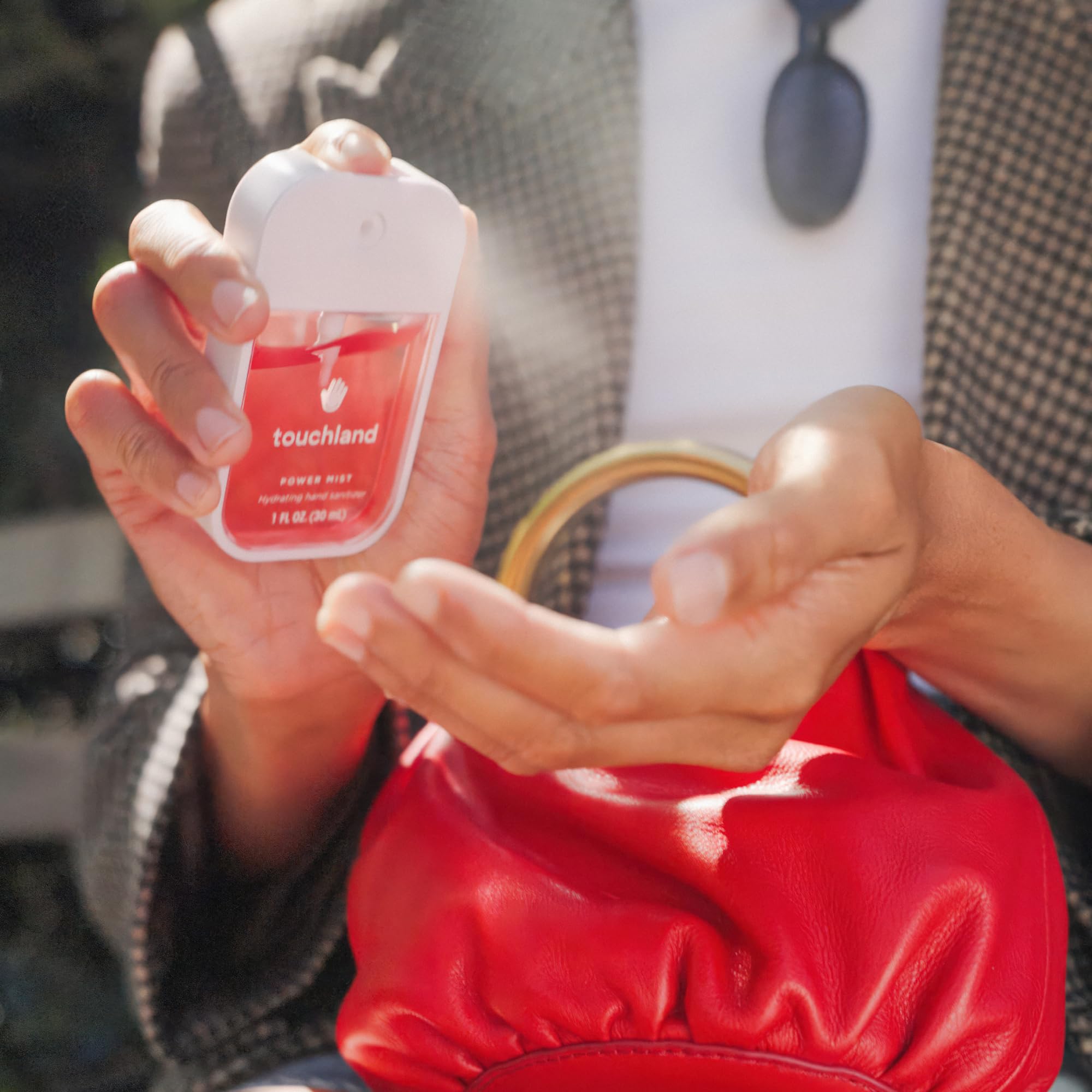 Touchland Juicy Trio Velvet Peach bottle for refreshing on-the-go use.