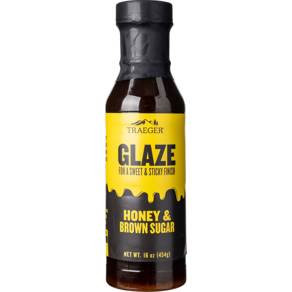 Traeger Honey & Brown Sugar Glaze bottle ready to glaze chicken for a glossy finish.