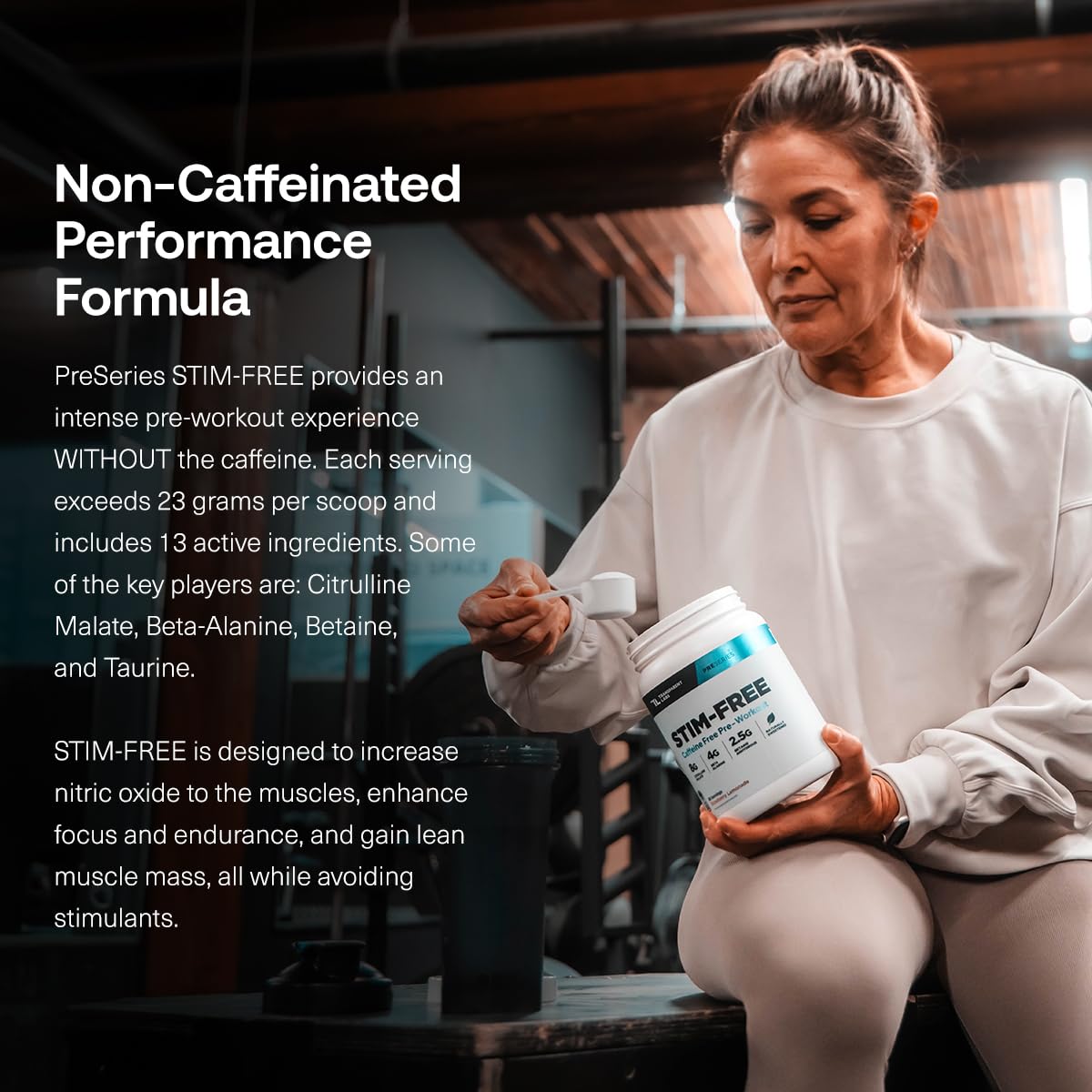 Transparent Labs Stim-Free Pre-Workout Tropical Punch bottle beside glass showing mix-ready powder.