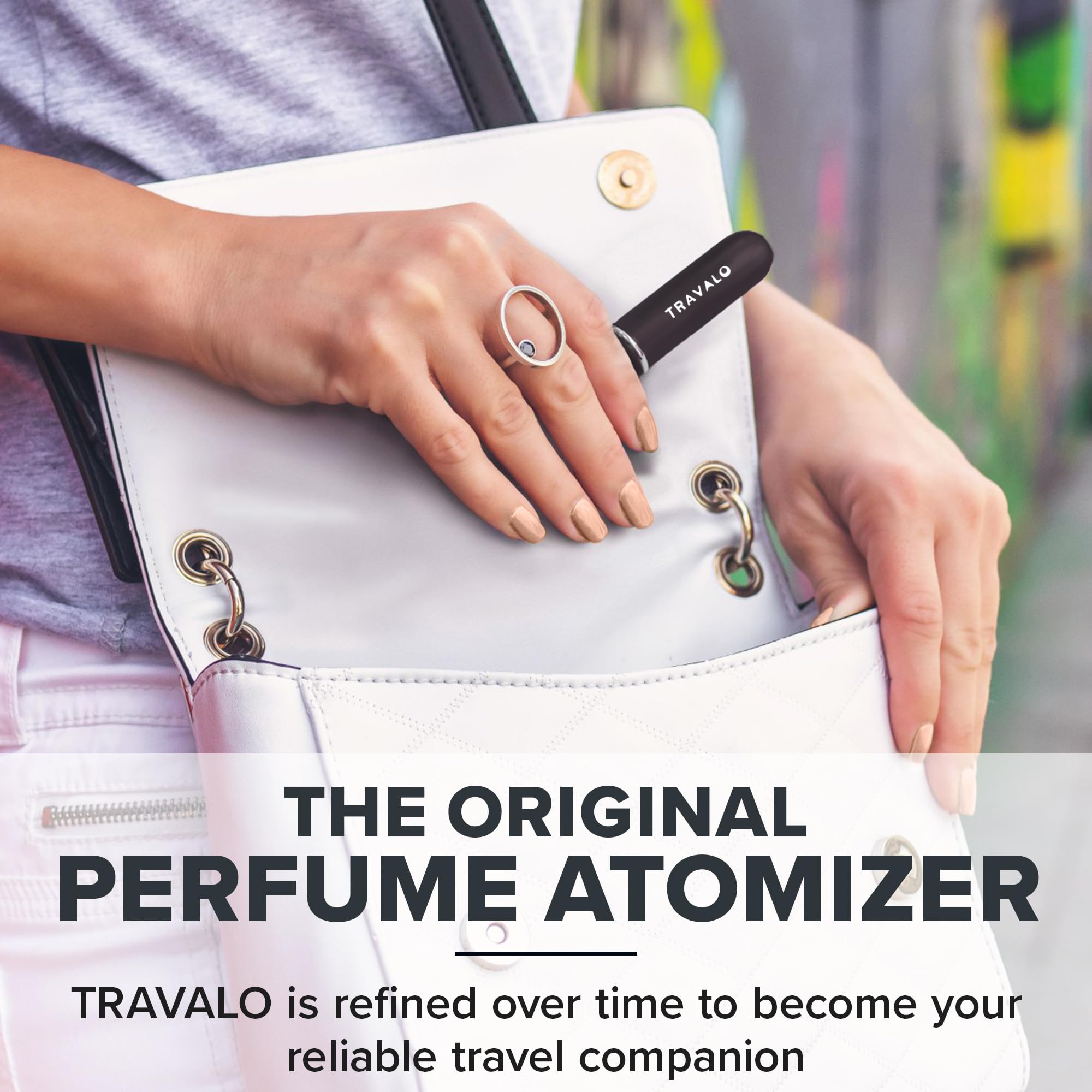 Travalo Classic HD being used on the go, slipping into a purse.