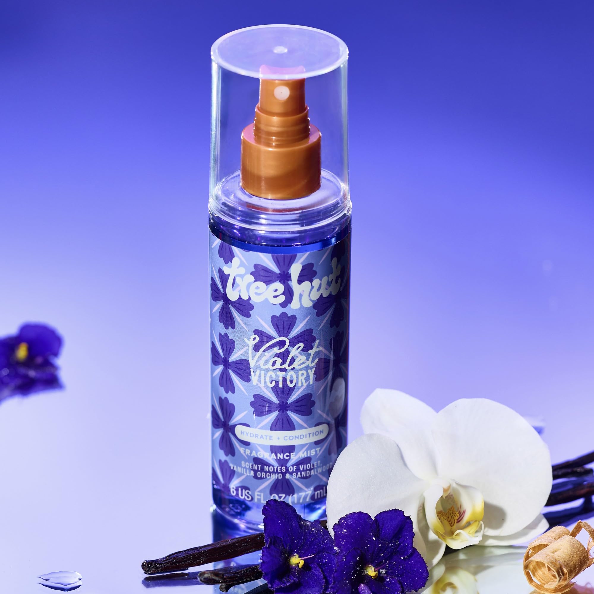 Tree Hut Violet Victory fragrance mist applied on skin for light, fast-refreshing scent.