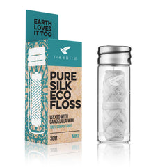 TreeBird Pure Silk Eco Floss in refillable glass dispenser with mint finish for a refreshing flossing experience.