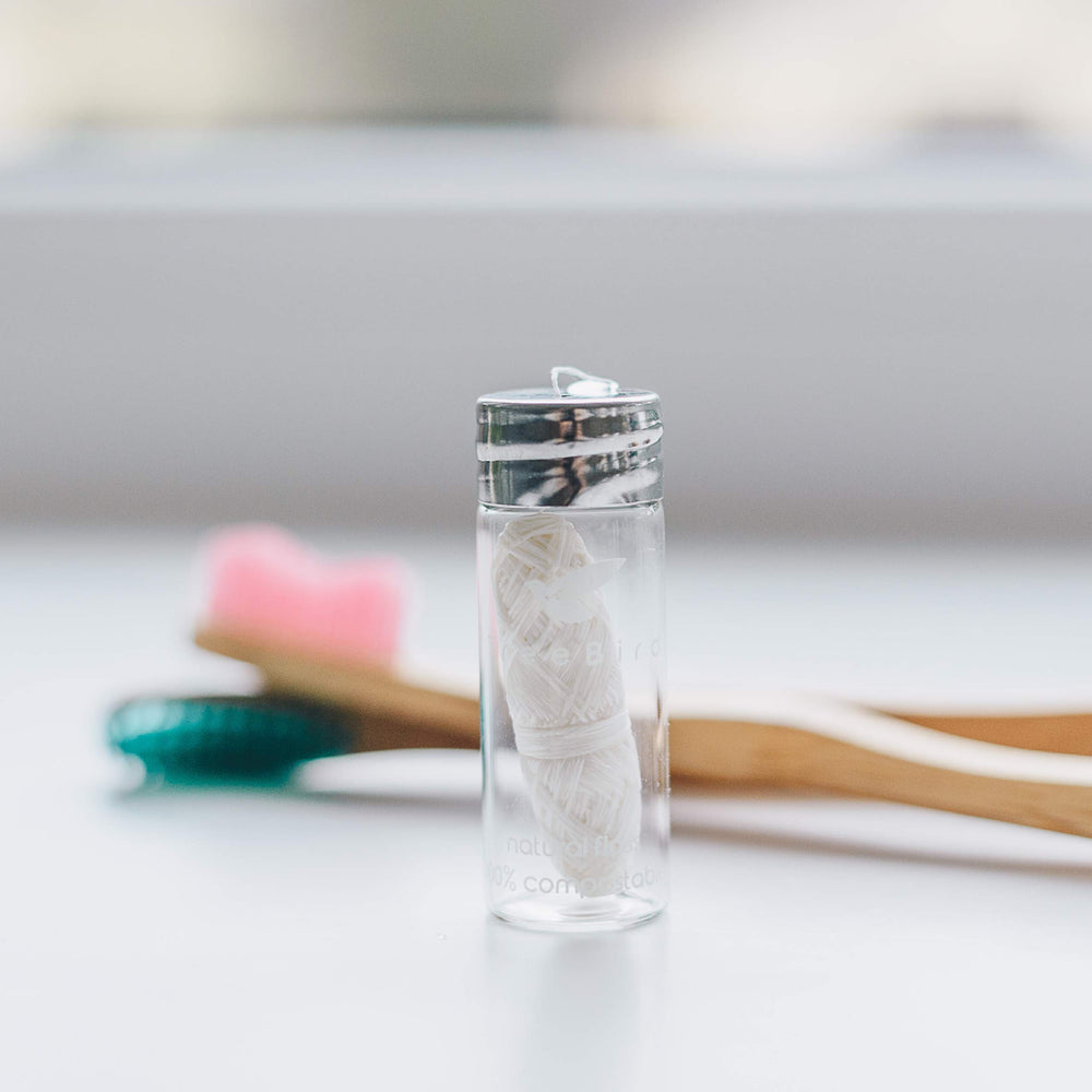 TreeBird Pure Silk Eco Floss in a clear glass dispenser shows floss level.