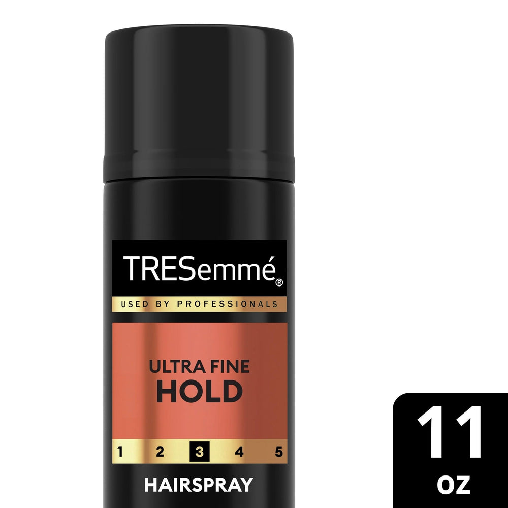 TRESemmé 24h frizz control spray maintaining sleek strands.