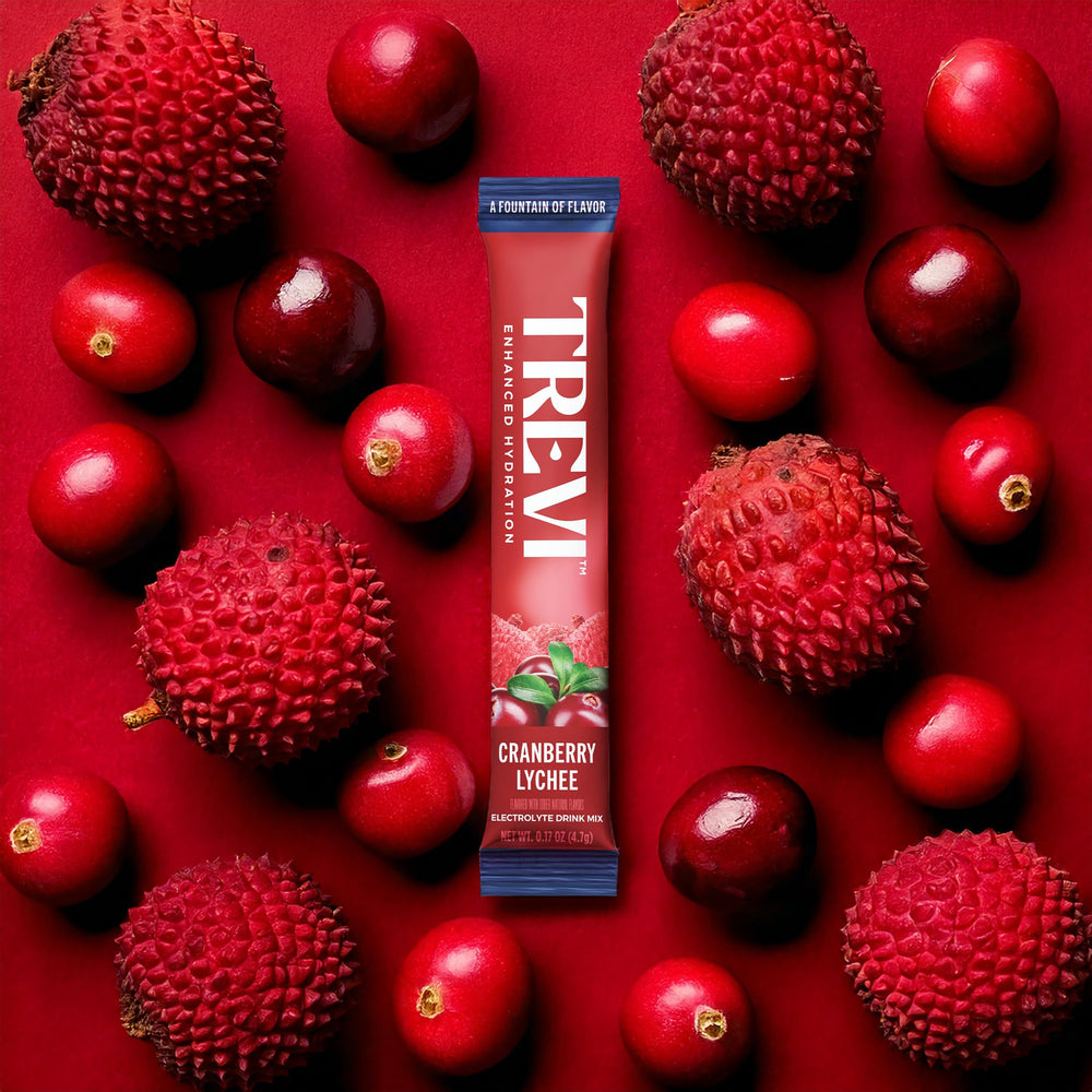 Close-up of TREVI Electrolytes packet highlighting Cranberry Lychee and zero sugar appeal.