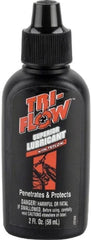 Bicycle chain coated with Tri-Flow for smoother operation.