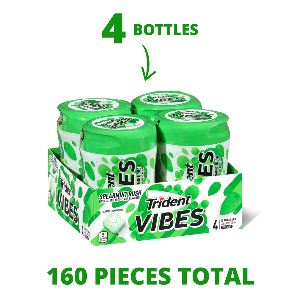 Trident Vibes Spearmint Rush bottle in hand for on the go freshness.