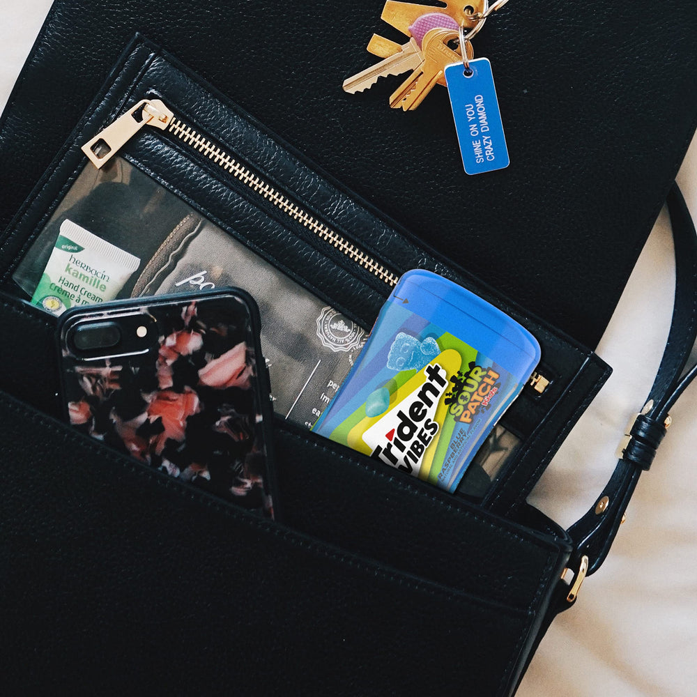 Travel-friendly gum bottle by Trident Vibes for on-the-go flavor.