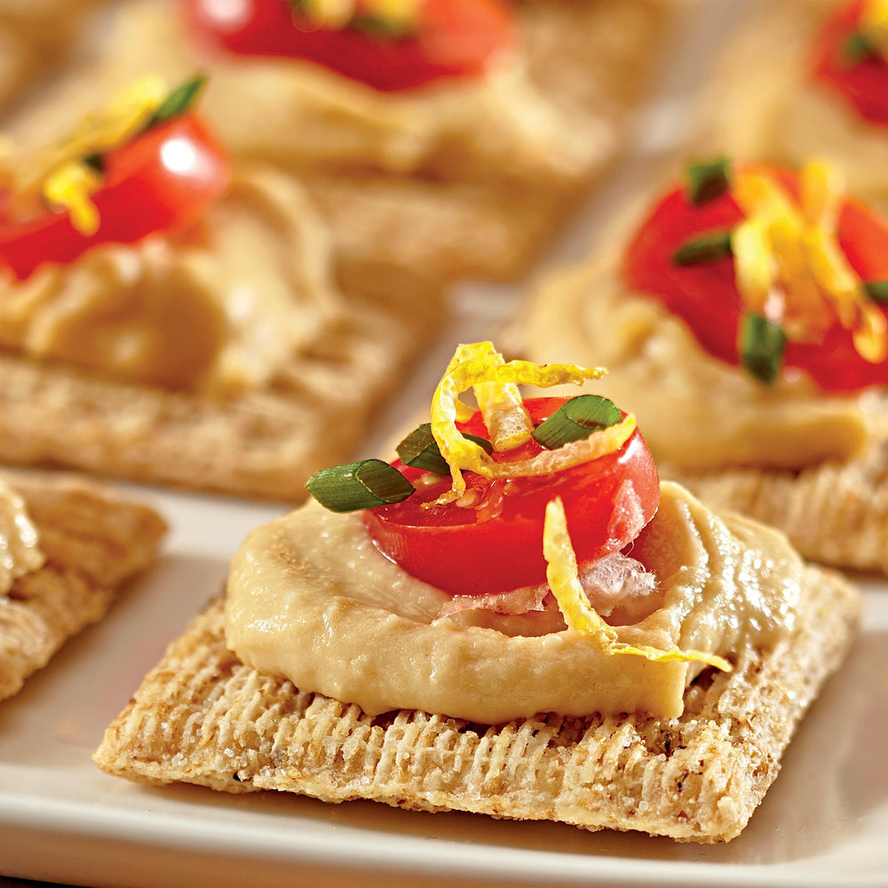 Triscuit Original cracker with hummus close-up—great for dipping