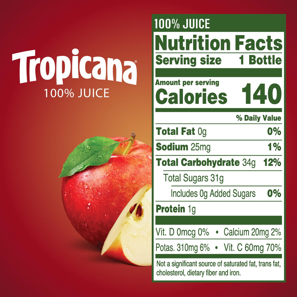 Tropicana Apple Juice 10 oz bottle being poured into a glass for refreshment