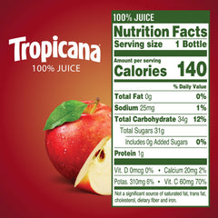 Tropicana Apple Juice 10 oz bottle being poured into a glass for refreshment