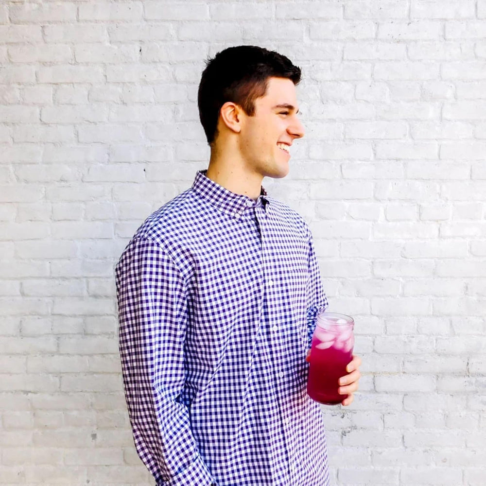 On-the-go packet beside a water bottle for travel with True Citrus Wildberry Lemonade.