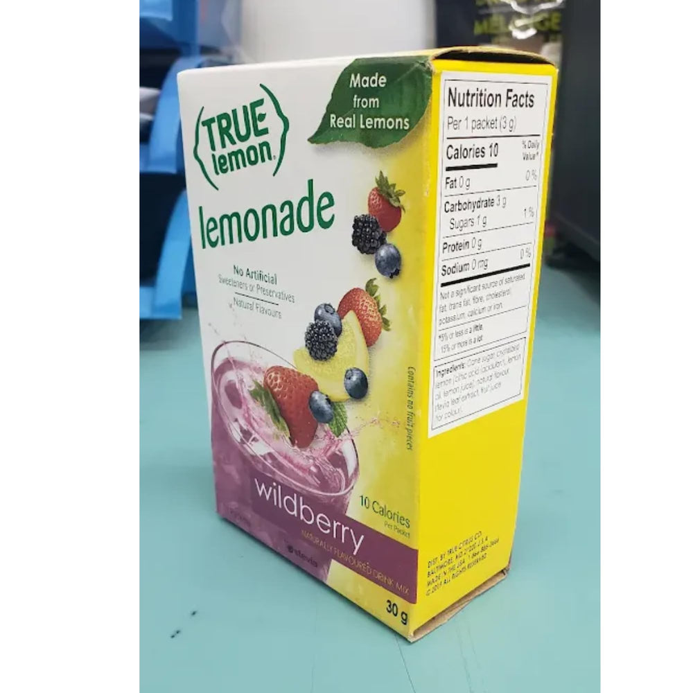 True Citrus Wildberry Lemonade poured into a glass with ice.