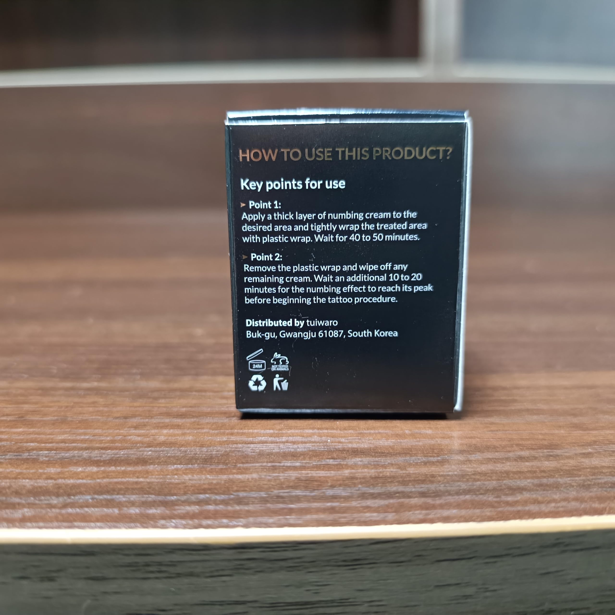 Tuiwaro Numbing Cream tube on shelf ready for daily skincare.