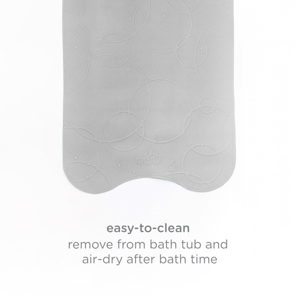 Ubbi gray bath mat complements bathroom decor while keeping baths safe.