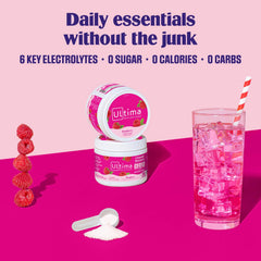 Ultima Replenisher Raspberry with scoop dissolving in a glass of water
