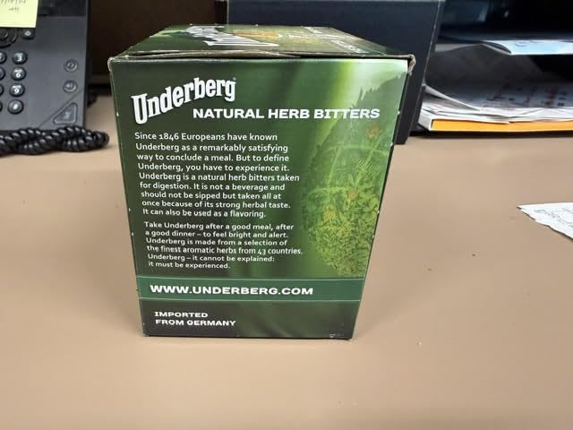 Underberg pour action capturing a single-portion bottle being enjoyed