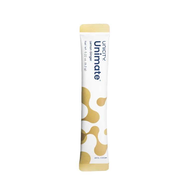 Unicity Unimate lemon-ginger packaging on kitchen counter.