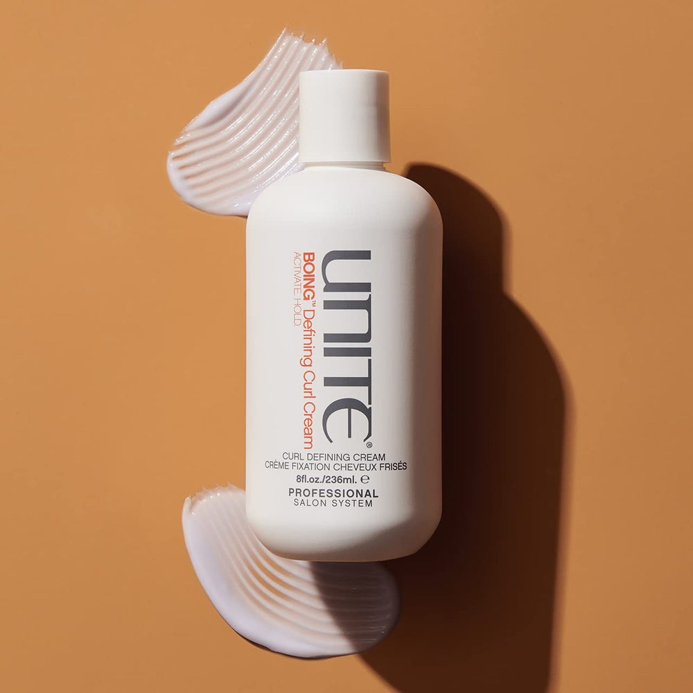 UNITE BoING Defining Curl Cream application scene enhances curl definition and moisture.