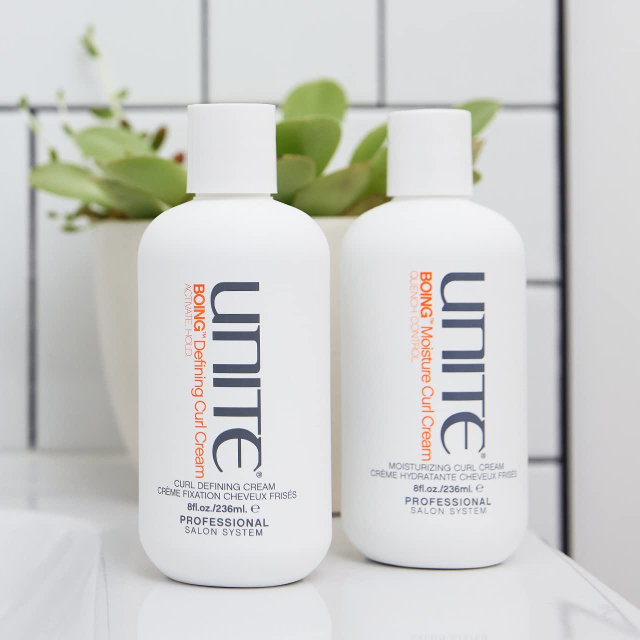 UNITE BoING Defining Curl Cream on damp hair shows texture, definition and frizz control.