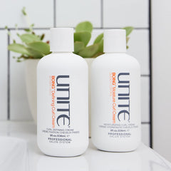 UNITE BoING Defining Curl Cream on damp hair shows texture, definition and frizz control.