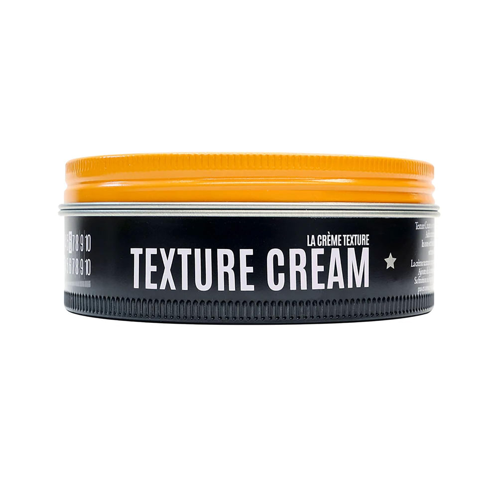 Hands styling hair with Texture Cream to demonstrate buildable hold.