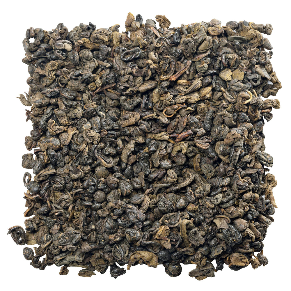 Gunpowder green tea pellets close-up framed for a premium, flavorful infusion.