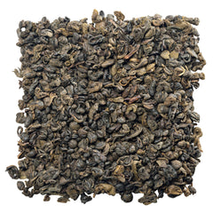 Gunpowder green tea pellets close-up framed for a premium, flavorful infusion.