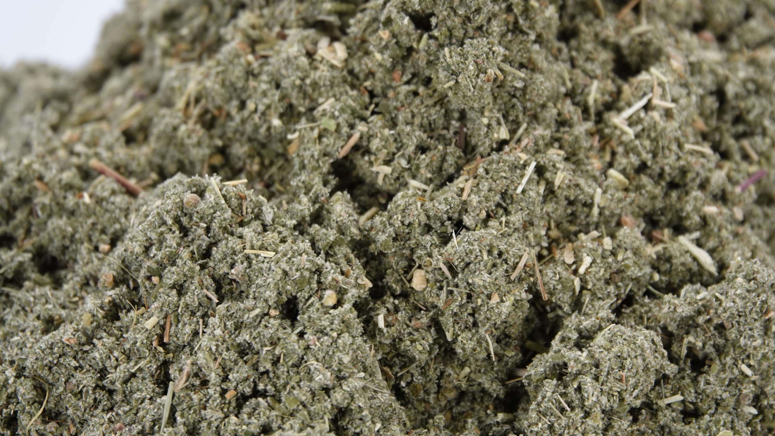 Close-up of loose raspberry leaf tea leaves ready for a fragrant brew by US Wellness Naturals.