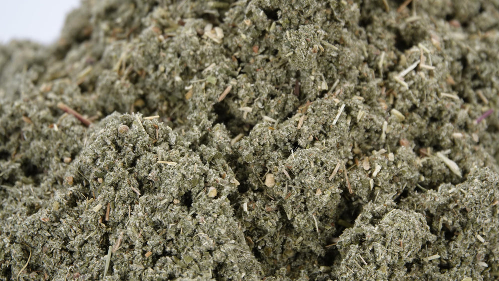 Close-up of loose raspberry leaf tea leaves ready for a fragrant brew by US Wellness Naturals.